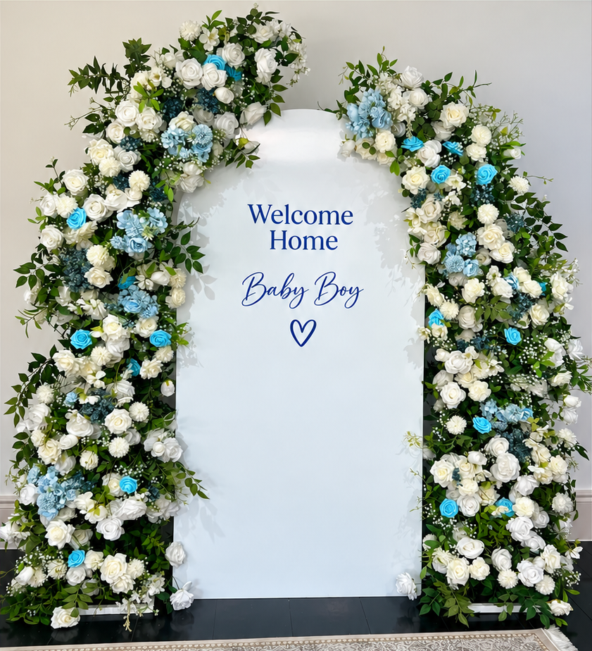 Personalised arch backdrop framed by two flower arches
