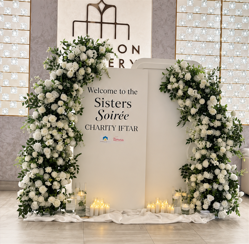Two ivory rectangular arch backdrops with flower arches and candle styling